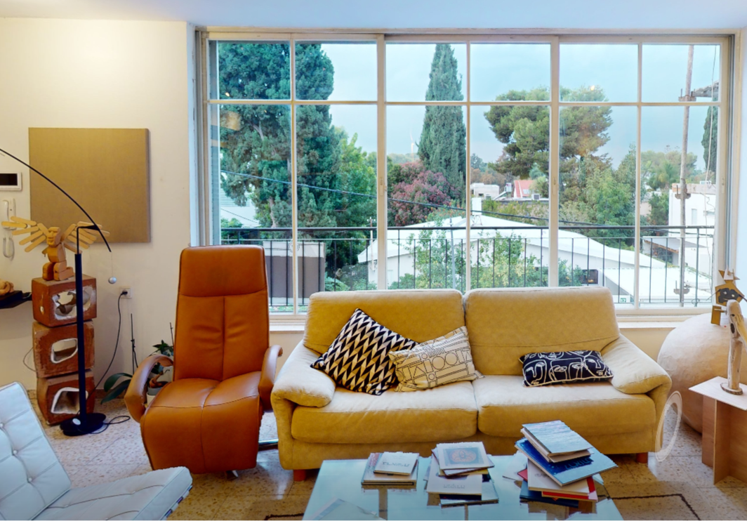 Living room with yellow sofa